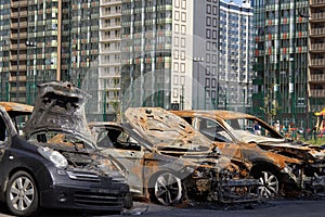 city burned cars after a fire in one of the city's districts