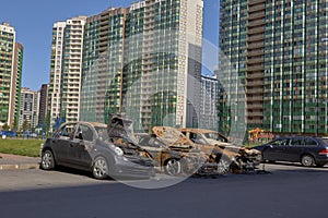 city burned cars after a fire in one of the city's districts