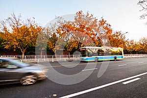 City bus moving on the road motion blurred