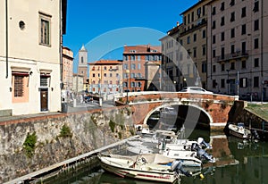 city canal in livorno, italy