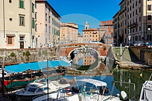 city canal in livorno, tuscany italy