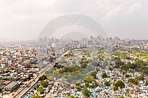 City cemetery in Manila, view from above. Old cemetery with residential buildings. City of Manila, in sunny weather.