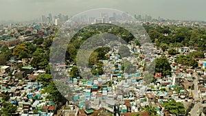 City cemetery in Manila, view from above. Old cemetery with residential buildings. City of Manila, in sunny weather.