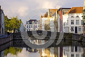 City center of Bruges in Belgium with a view of a canal - cloudy day