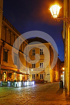 City center by night: ancient temements Krakow, Poland