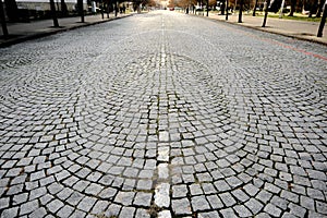 City center of small town Kardzali with cobblestone way and street lines near city park.