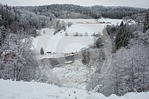 City Cesis, Latvia.River Amata at winter,  trees and snow