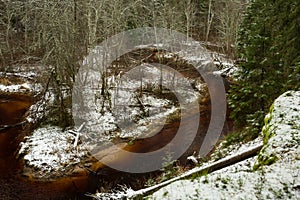 City Cesis, Latvia. River in winter. Snow and water.Travel photo