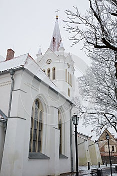 City Cesis, Latvia. Street with old church and tree.Travel photo