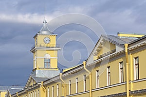 City Clock Tower over the yellow house, urban architecture