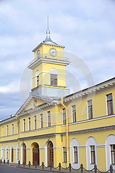 City Clock Tower over the yellow house, urban architecture
