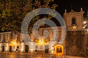 The city council in the old town of Loule at the Algarve, Portugal. Town hall illuminated at night photo
