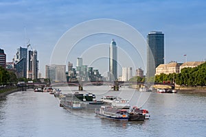 City cruise ships on the river Thames, on background Lambeth Br