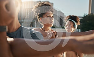 City, diversity and outdoor group workout, running club stretching before morning run in city street. Fitness, friends