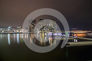 City by the docks at night photo