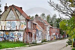 Empty houses covered with graffiti photo