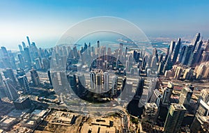 City downtown aerial view of Dubai skyscrapers at sunset