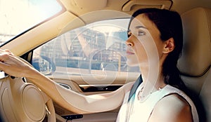 City, driving and business woman in car to travel on journey and route transportation to job in town. Morning, driver or