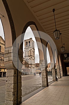 City of Ferrara downtown, turret or bell tower of saint George cathedral is in background, Italy