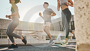 City, fitness and friends running on a road for a cardiovascular workout, exercise and marathon training. Runners, man