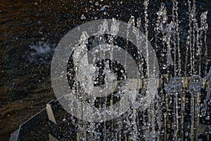 City fountain with splashes and jets of water hardened