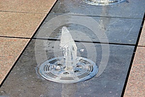 City fountain on a summer sunny day