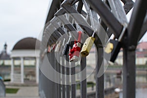 In the city garden, it is customary to hang locks on the bridge as a symbol of eternal love. photo