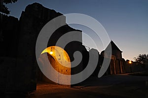 City gates of medieval Provins at night in France