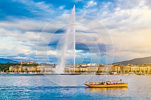 City of Geneva with famous Jet d'Eau fountain at sunset, Switzerland