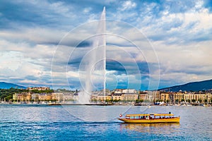 City of Geneva with famous Jet d'Eau fountain at sunset, Switzerland