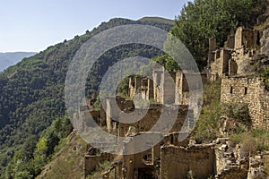 City - ghost, Dagestan, Russian - 1 SEPTEMBER, 2019: City of ancient ruins, city - ghost, mountainous area with green vegetation