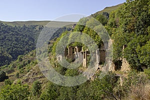 City - ghost, Dagestan, Russian - 1 SEPTEMBER, 2019: City of ancient ruins, city - ghost, mountainous area with green vegetation