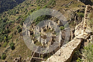 City - ghost, Dagestan, Russian. City of ancient ruins, city - ghost, mountainous area with green vegetation