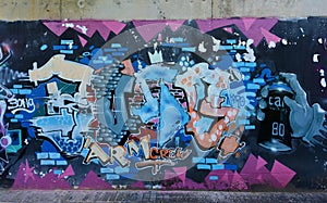 The city graffiti on the cement wall