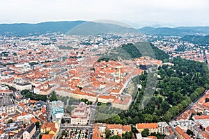 City Graz center aerial view with SchloÃŸberg, Uhrturm, central park