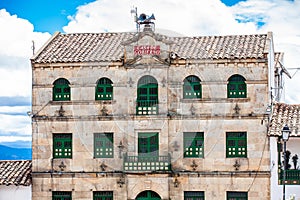 City Hall building of the beautiful small town of Mongui Translation of the sign on top: House of Goverment photo