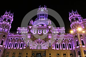 City Hall building illuminated in purple for Women's Day