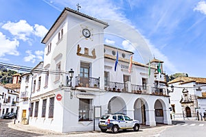 City Hall of Grazalema, considered one of the most beautiful white villages in Spain, with a Local Police Policia Local car photo