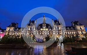 The city hall of Paris decorated with Christmas trees at night. Paris, France.