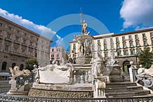 City Hall Square with the famous Neptune fountain on Piazza Municipio in Naples, Italy.