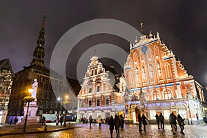 City Hall Square with House of the Blackheads and Saint Peter church in Old Town of Riga at night during Christmas, Latvia