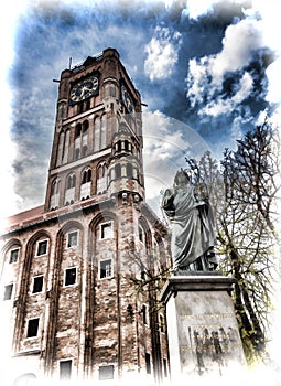 City Hall Tower and Monument of Nicolaus Copernicus in Torun in Poland