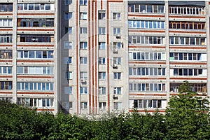 City high-rise building under the sun rays.