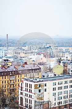 City of Kyiv (Kiev), capital of Ukraine, panorama. Colorful houses and Dnipro river on a background.