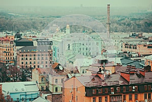 City of Kyiv (Kiev), capital of Ukraine, panorama. Colorful houses and Dnipro river on a background.