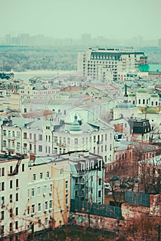 City of Kyiv (Kiev), capital of Ukraine, panorama. Colorful houses and Dnipro river on a background.