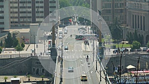 City landscape with crossroad, cars, buses, motorcycles, taxis are moving, top view