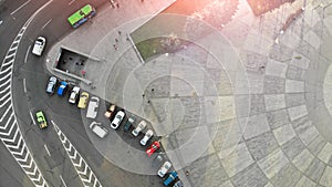 Aerial. City landscape fragment with a parking lot with cars.
