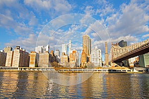 City landscape of Manhattan under bright morning sun.