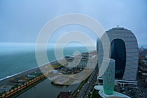 City landscape. Modern architecture of Batumi. A popular resort on the Black Sea coast in Georgia. Cloudy rainy day